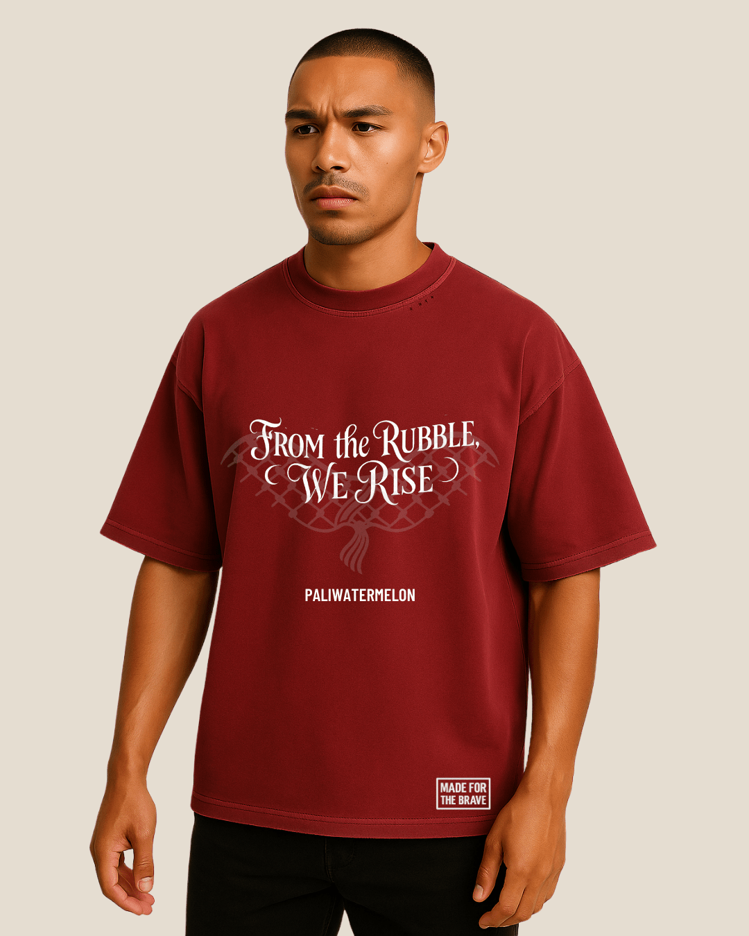 Model wearing burgundy oversized T-shirt with resistance message on front.